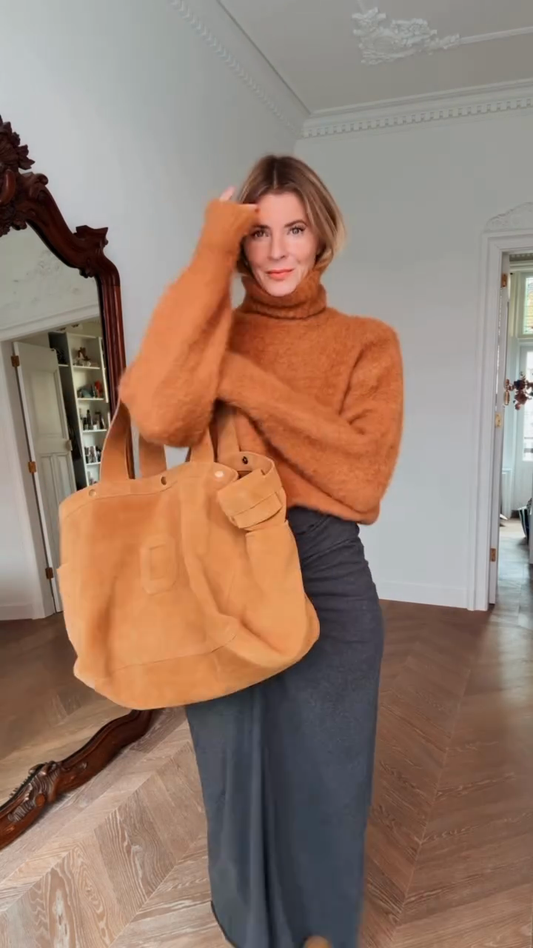 Orange turtleneck sweater