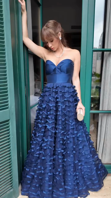 Blue off-the-shoulder ruffled ball gown